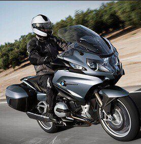 Black BMW motorcycle riding